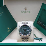 Rolex Datejust 41 Grün Motif - 126334 - LC100 02/2023 - Neuwertig/Teilverklebt - Discontinued - Full Set